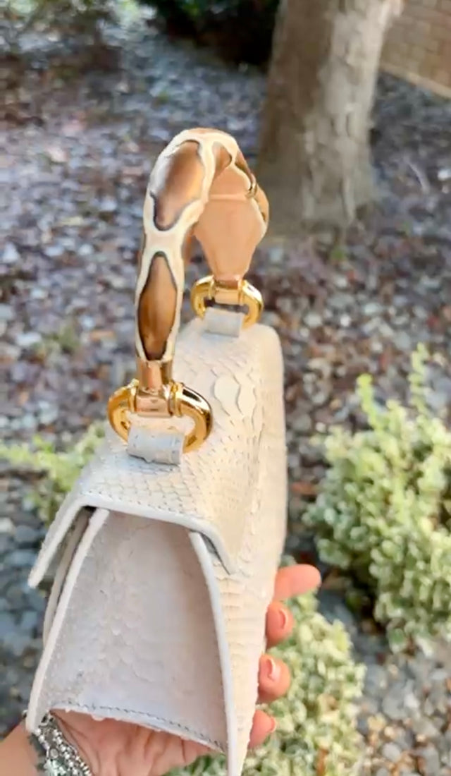 Python top handle bag with serpent handle charm