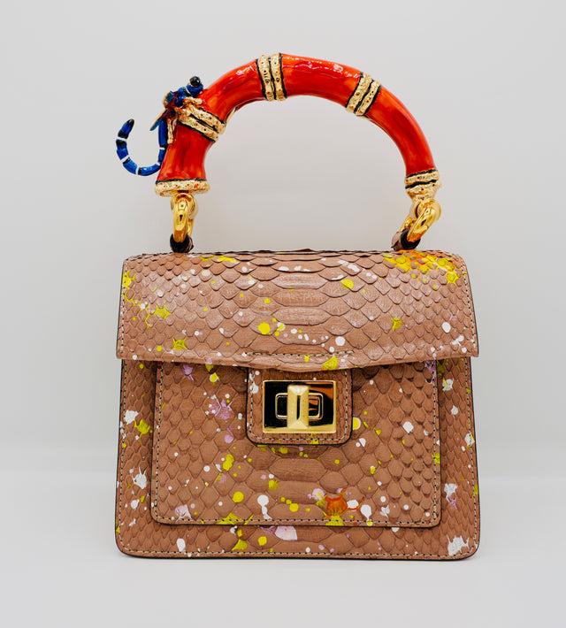 Poudre Python Art Bag with red top handle and blue dragonfly charm