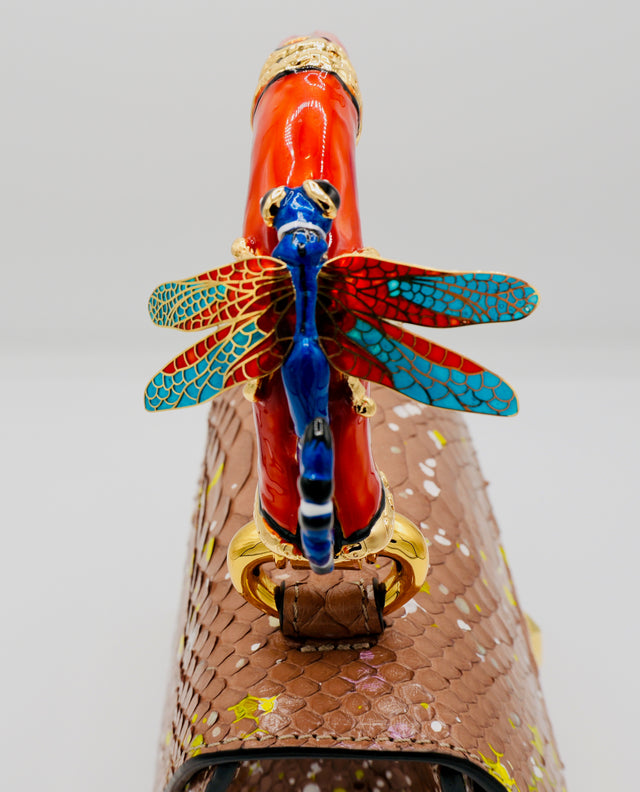 Poudre Python Art Bag with red top handle and blue dragonfly charm