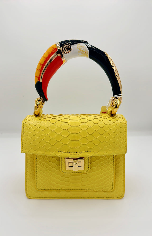 Yellow python handbag with hand-painted toucan bird enamelled brass handle