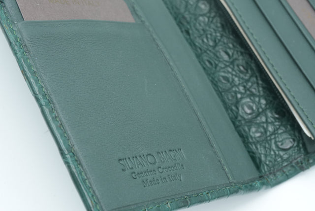 Green leather wallet with 'Silvano Lucini' branding on a white background