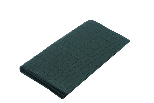 Green crocodile-patterned wallet on a light gray background