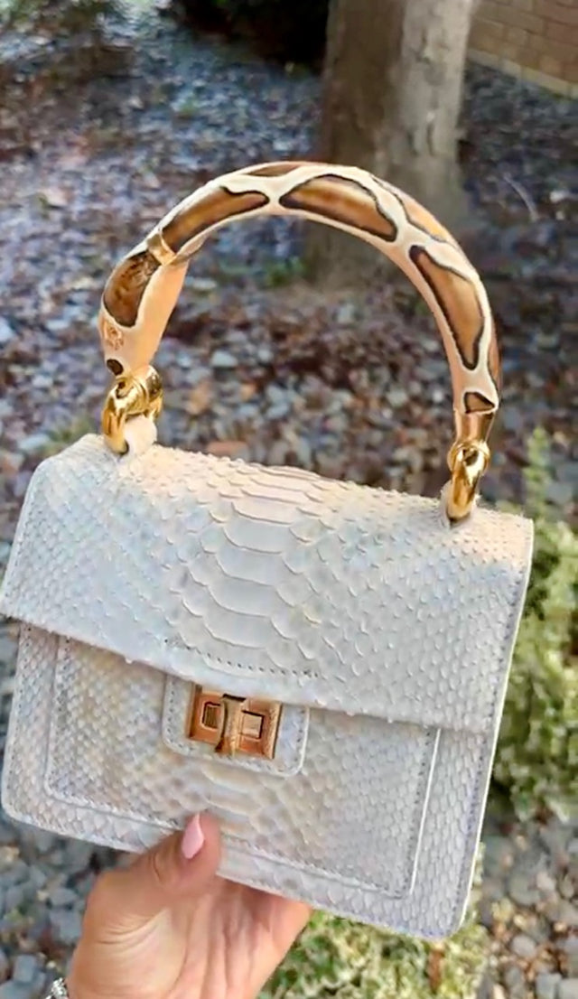 Python top handle bag with serpent handle charm