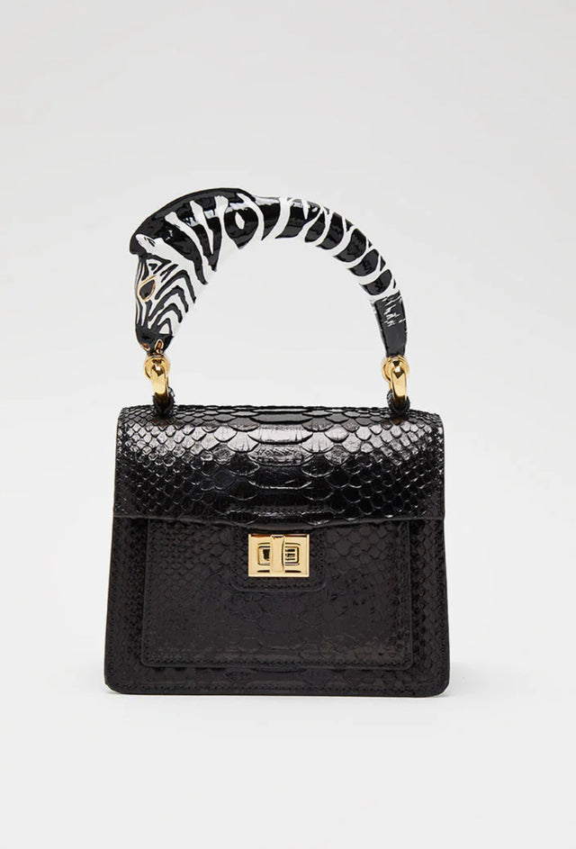 Python top handle bag with black zebra handle charm